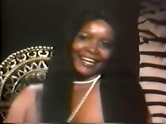 Delicious and pretty vintage black chick with enormous breasts
