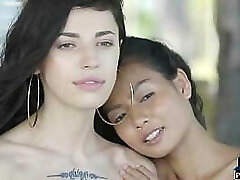 Petite Asian and Russian teen lesbians outdoor posing
