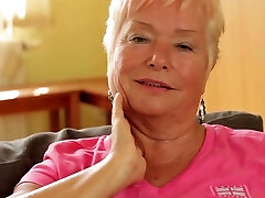 Slutty granny tucks a huge dildo deep inwards of her twat