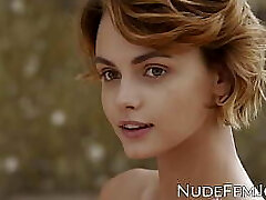 Gorgeous redhead teases with her all-natural tits and soft pussy