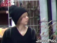 Japanese cuties flash hairy pussies during public pissing
