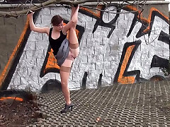 Rather lithe inexperienced black head pulls up one leg and pisses outdoors