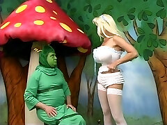 Sexy Alice with giant globes gets lost in wonderland and plays with a caterpiller
