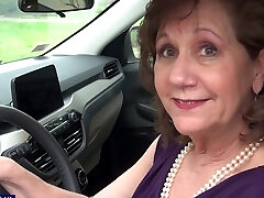 Brunette Demi wearing black lingerie pleasuring her clean-shaven cunt