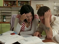 Teenage sweetie in miniskirt seduces her coed in her kitchen