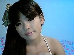 Japanese cutie Mina poses for her webcam showing her little