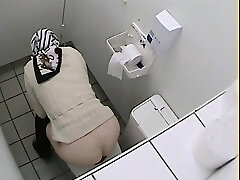 Granny got her ass on rest room voyeur video while pissing