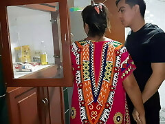 My step-mom gives me a blowjob in the kitchen