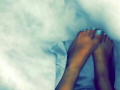 Little feet under the covers