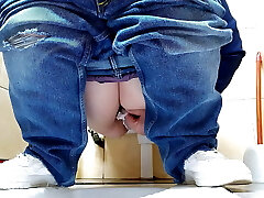 Super-steamy MILF in jeans pissing in a public restroom