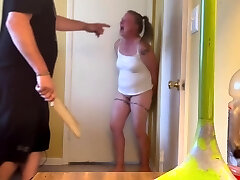 Bad doll gets a paddling