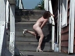 Really wild nympho uses a dildo to pet her raw pussy right outdoors