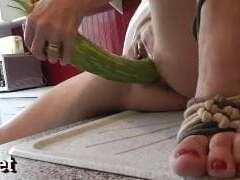 naomi1 in a kitchen with a vegetable