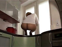 This slut likes to display off her nylon covered arse on top of the kitchen counter