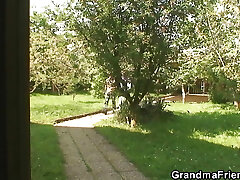 Sexy old lady takes two big cocks at once