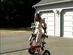 Gagged and restrained slave doll gets driven around while being torn up by a machine