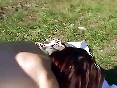 Brunette MILF with glasses loves sucking cock on her knees out in the fields