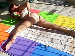 An attractive lady is sunbathing on the roof of her house. Nude yoga Touch pussy outdoors. 1