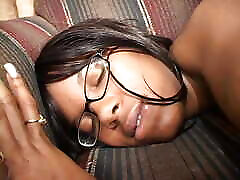 Brunette slut blows a hot black cock and fucks it on the sofa