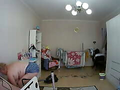 mother-in-law cleans the room naked