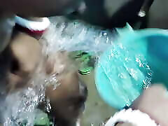 Husband helps his wife bathing