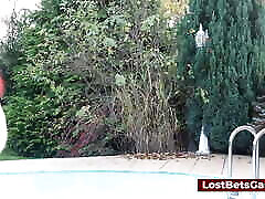 Three girls are playing trip wrestling outdoors