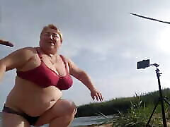 Mother-in-law sucks my dick on the beach and gets cum in her mouth