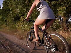 Cycling Outdoors And Flashing Ass In Miniskirt