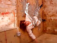 Kinky Stud Gets a Unique Blowjob From a Slut Taped on a Wall