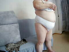 Mother-in-law with big tits caresses herself in front of the camera