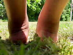Mommy Barefoot Outside Plays in the Grass