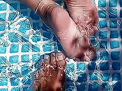 Cleaning the pool while barefoot
