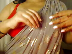 Desi hot red bra girl has fun by showing her boobs.