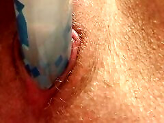 Close up- zoomed giving pleasure with a glue stick.