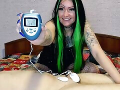 Electrostimulation of the penis and testicles. Dominatrix Nika plays with electric discharges on the genitals of the slave