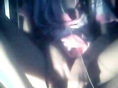The camera under the table captured a beautiful woman at home alone and watching a porn movie.