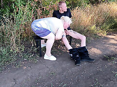 A neighbor sucks my dick in a public park on a bench until I cum