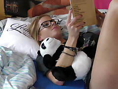 Adorable girl in big t-shirt on bed