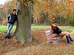 Hot red colored girl stays and enjoys outdoor masturbation