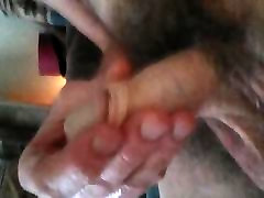 Stroking my limp penis.