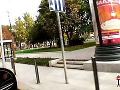 Kinky girlie shows tits and smooth ass right in the car to seduce the driver