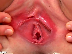 Titless red head Zhenia stretches vulvar lips for tickling fancy