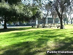 Brunette whore Amy Brooke gives a blowjob hiding from public behind the tree