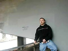 Me masturbating near a bridge