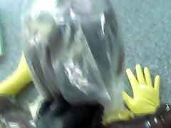 Kinky dude in a latex suit fucks his plump maid slave
