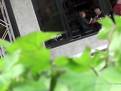 public upskit - blue suit in street cafe