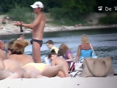 Cute big tittied girls lying on the nudist beach