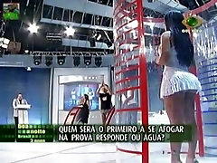 Tanned slut flashing her crotch on the TV camera