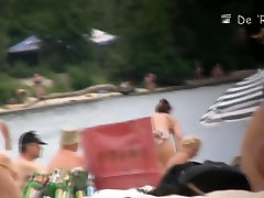 Blonde model showing her ass on a nudist beach