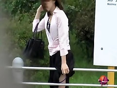 Sharking her skirt to lock her panties to the metal rail